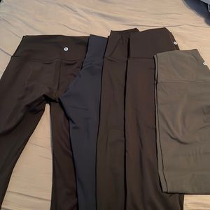 Lululemon Size 8 length 23in. Good condition. Black-Navy-Gray